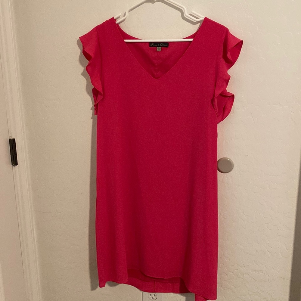 Lined pink dress with small ruffle sleeves.